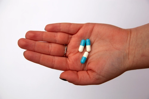 antibiotics being held in a hand